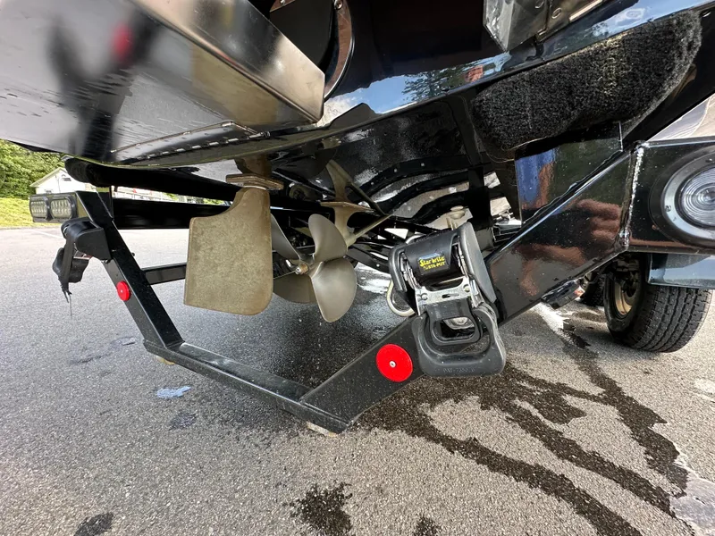 Slide: The Image of 2023 MasterCraft NXT 22 boat propeller and trailer close-up. - 14