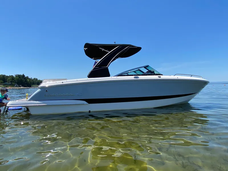 Slide: The Image of 2019 Chaparral 257 SSX boat on clear water under blue sky. - 1