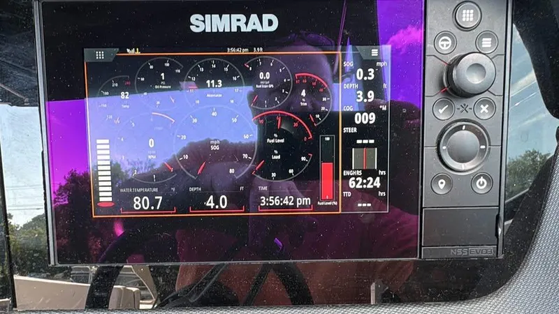 Slide: The Image of Simrad display on 2019 Chaparral 257 SSX showing engine and navigation data. - 9