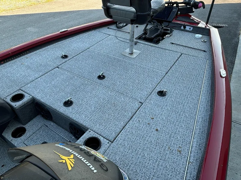 Slide: The Image of 2020 Tracker Pro Team 195 TXW Tournament Edition fishing boat deck with seating and storage compartments. - 5