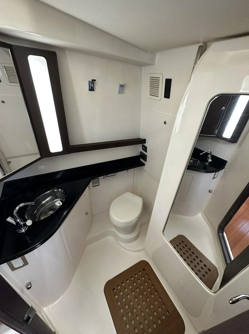 Slide: The Image of 2019 Grady-White Canyon boat bathroom with modern fixtures and sleek design. - 10