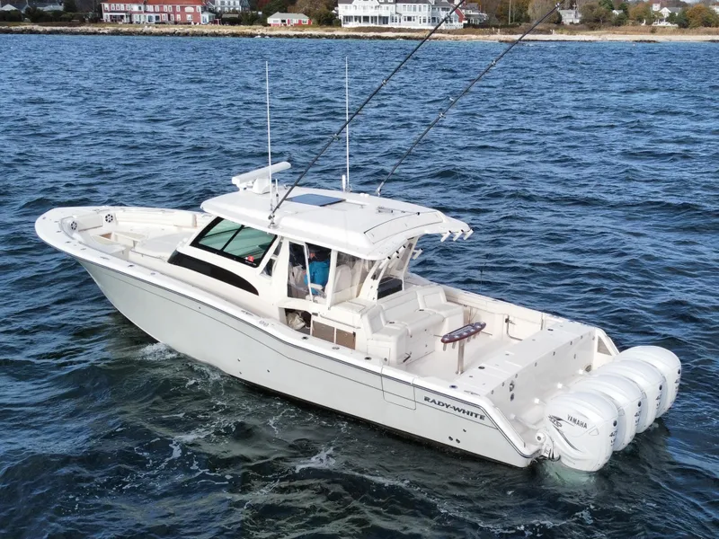 Slide: The Image of 2019 Grady-White Canyon boat cruising on open water. - 14