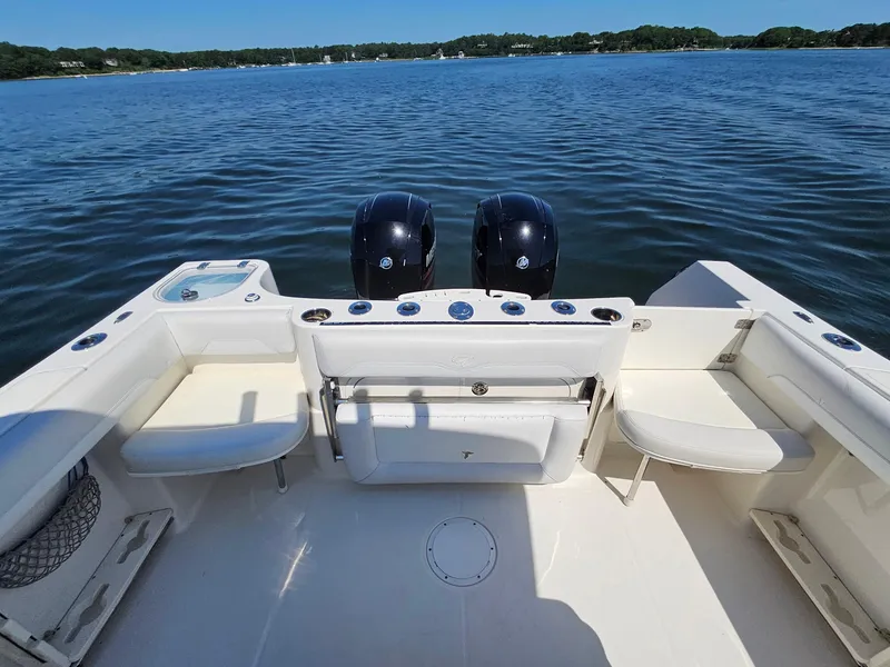 Slide: The Image of 2016 Sailfish 270 CC boat with dual engines on calm water. - 10