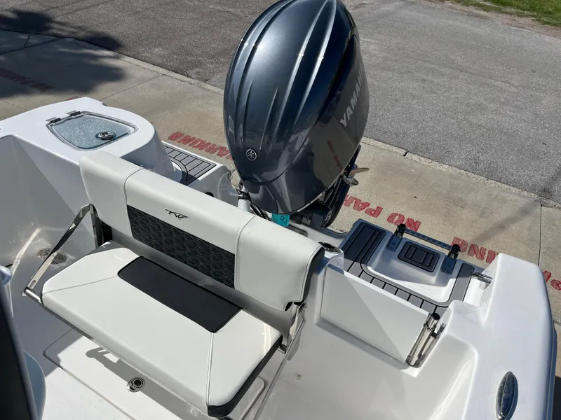 Slide: The Image of 2025 Tidewater 210 CC Adventure boat with Yamaha outboard motor. - 10