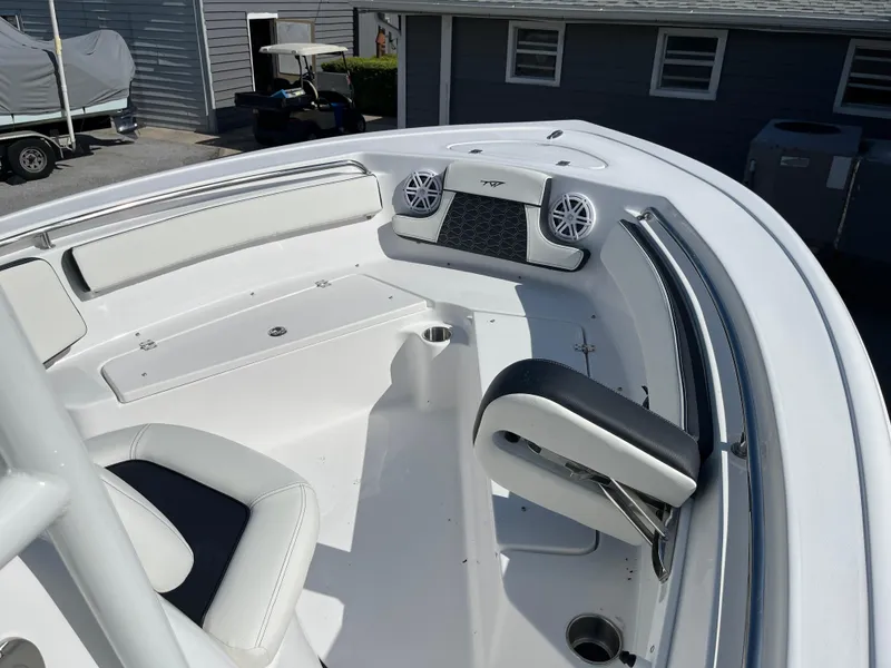 Slide: The Image of 2025 Tidewater 210 CC Adventure boat interior with seating and speakers. - 6
