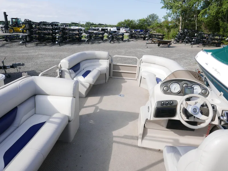 Slide: The Image of 2005 Sylvan Mirage 820 pontoon boat with spacious seating and modern dashboard. - 11