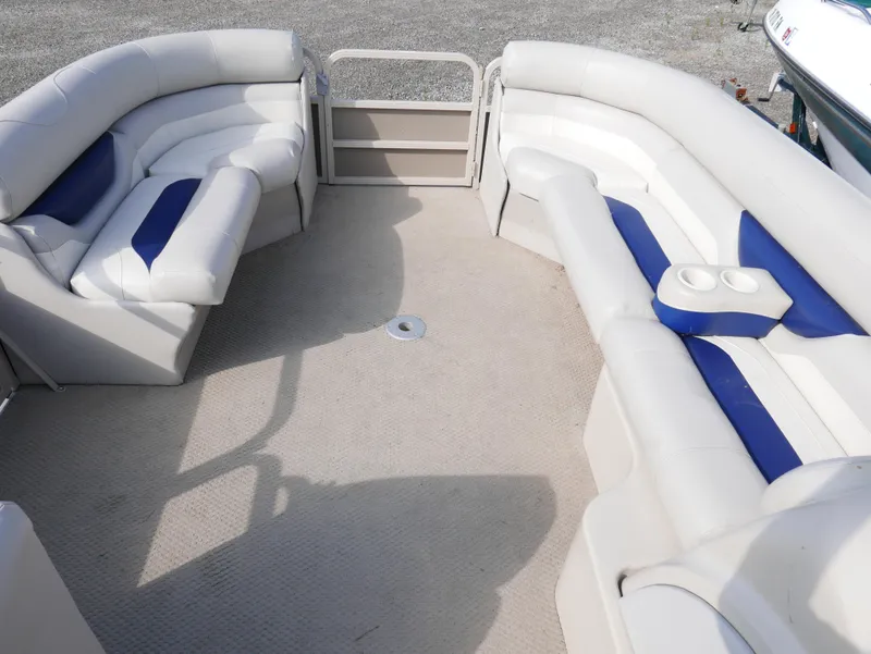 Slide: The Image of 2005 Sylvan Mirage 820 pontoon boat interior with white and blue seating. - 4