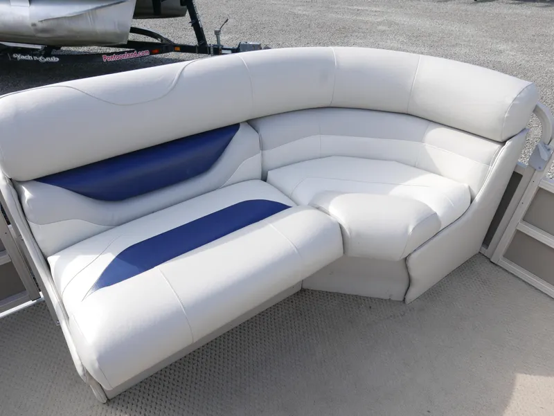 Slide: The Image of 2005 Sylvan Mirage 820 pontoon boat seating with white and blue upholstery. - 5