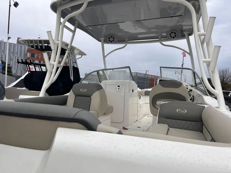 Slide: The Image of 2025 Key West 239 DFS boat interior with seating and canopy. - 2