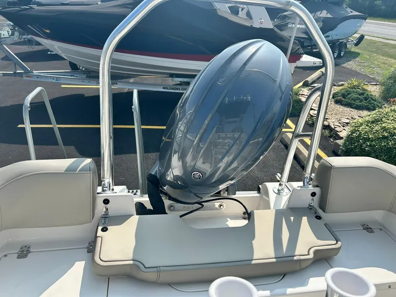 Slide: The Image of 2025 Key West 203 FS boat with outboard motor and seating area. - 11