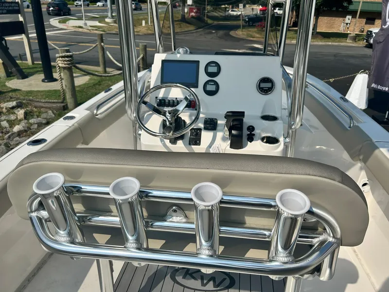 Slide: The Image of 2025 Key West 203 FS boat console with steering wheel and rod holders. - 9