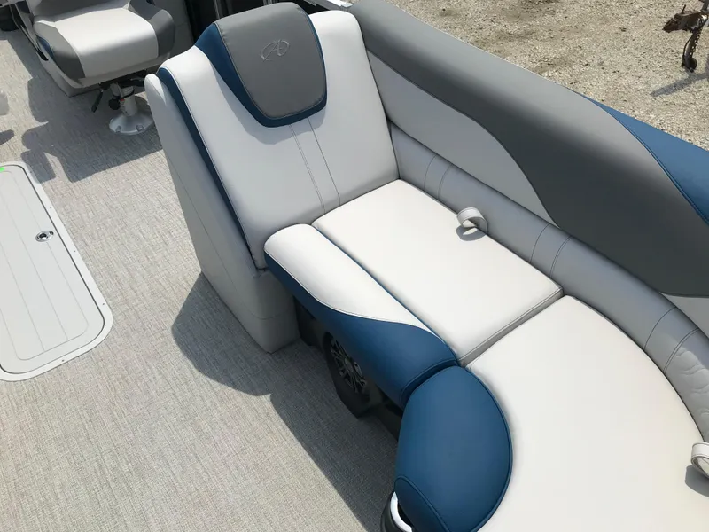 Slide: The Image of Avalon LSZ Quad Lounger 2025 boat interior with blue and white seating. - 11