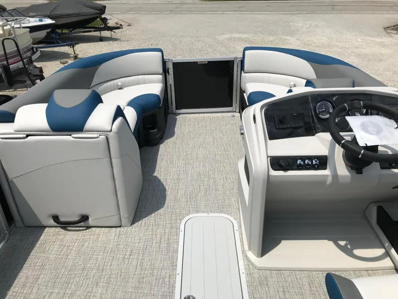 Slide: The Image of 2025 Avalon LSZ Quad Lounger boat interior with plush seating and cup holders. - 15