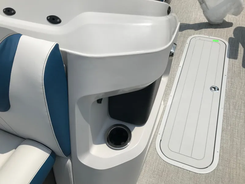 Slide: The Image of 2025 Avalon LSZ Quad Lounger boat interior with plush seating and modern dashboard. - 20