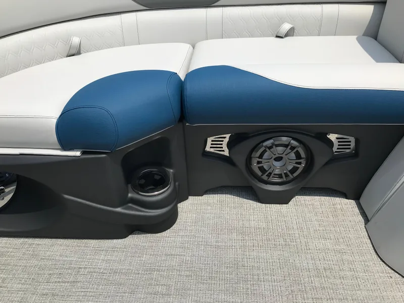 Slide: The Image of 2025 Avalon LSZ Quad Lounger boat seating with blue and white upholstery. - 22