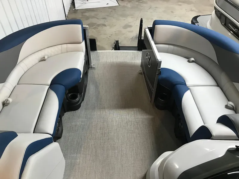 Slide: The Image of 2025 Avalon LSZ Quad Lounger boat interior with steering console and seating. - 28