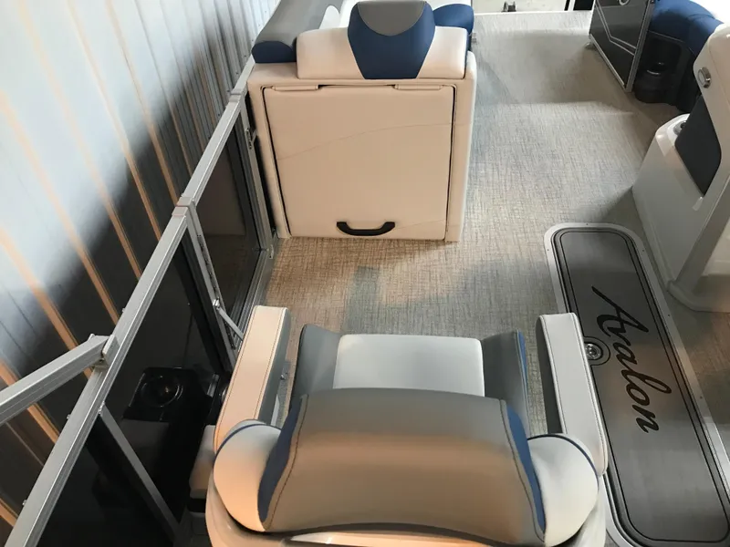 Slide: The Image of 2025 Avalon LSZ Quad Lounger interior with blue and white seating in a spacious layout. - 29