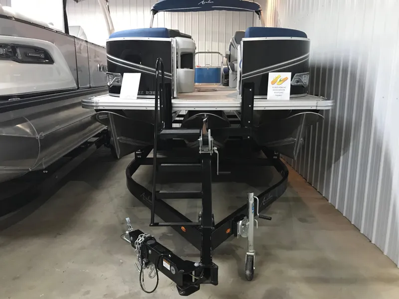Slide: The Image of 2025 Avalon LSZ Quad Lounger pontoon boat on a trailer. - 4