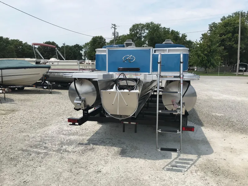 Slide: The Image of 2025 Avalon LSZ Quad Lounger pontoon boat on trailer in showroom. - 5