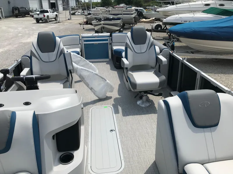 Slide: The Image of 2025 Avalon LSZ Quad Lounger pontoon boat interior with luxurious seating and modern design. - 8