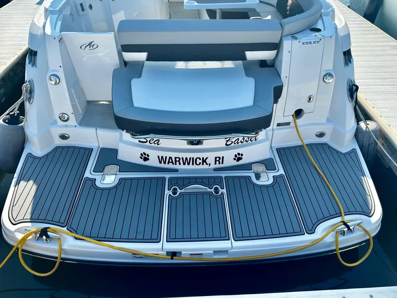 Slide: The Image of 2021 Monterey 335 Sport Yacht docked, featuring spacious deck and seating, Warwick, RI. - 12
