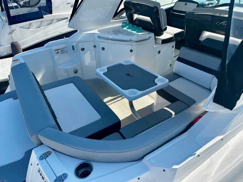 Slide: The Image of 2021 Monterey 335 Sport Yacht interior with seating and table, showcasing luxury and comfort. - 14