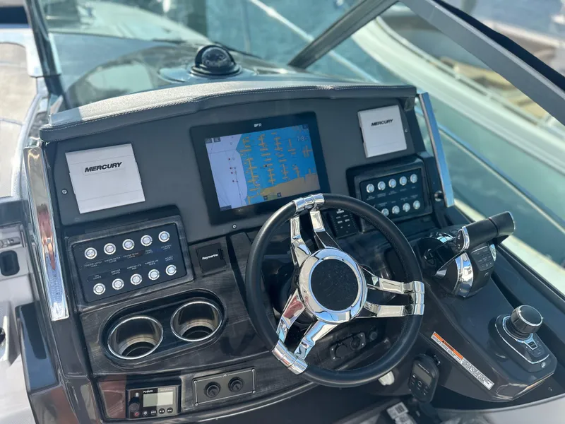 Slide: The Image of 2021 Monterey 335 Sport Yacht dashboard with navigation screen and controls. - 22