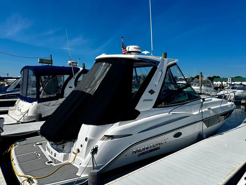 Slide: The Image of 2021 Monterey 335 Sport Yacht docked at marina under clear blue sky. - 3