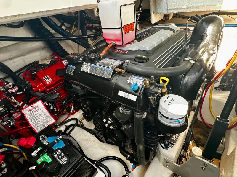 Slide: The Image of Engine compartment of a 2021 Monterey 335 Sport Yacht, showcasing detailed mechanical components. - 34