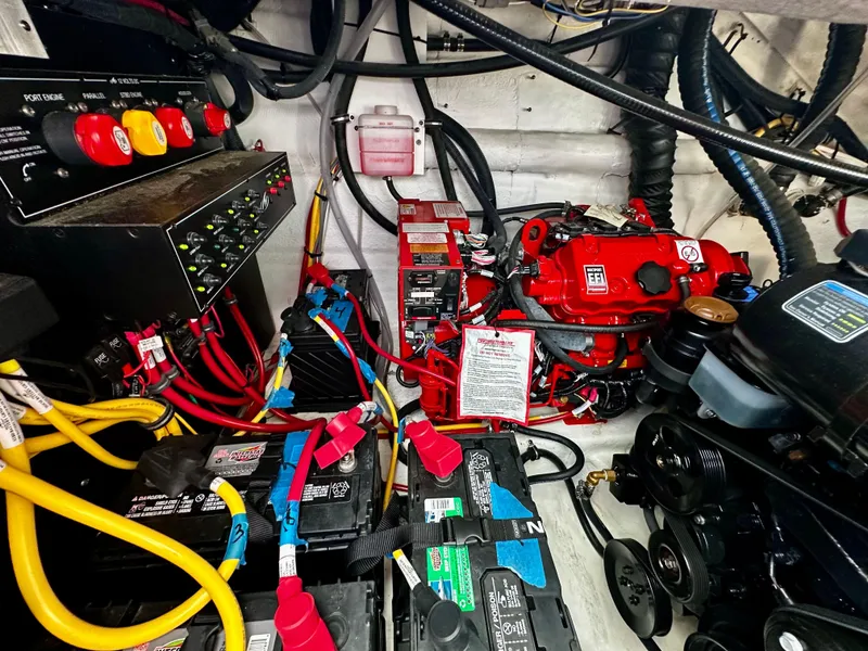 Slide: The Image of Engine room of a 2021 Monterey 335 Sport Yacht with visible wiring and components. - 36