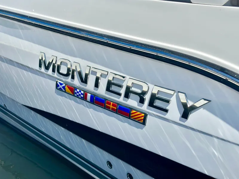 Slide: The Image of 2021 Monterey 335 Sport Yacht with nautical flags on the side. - 4
