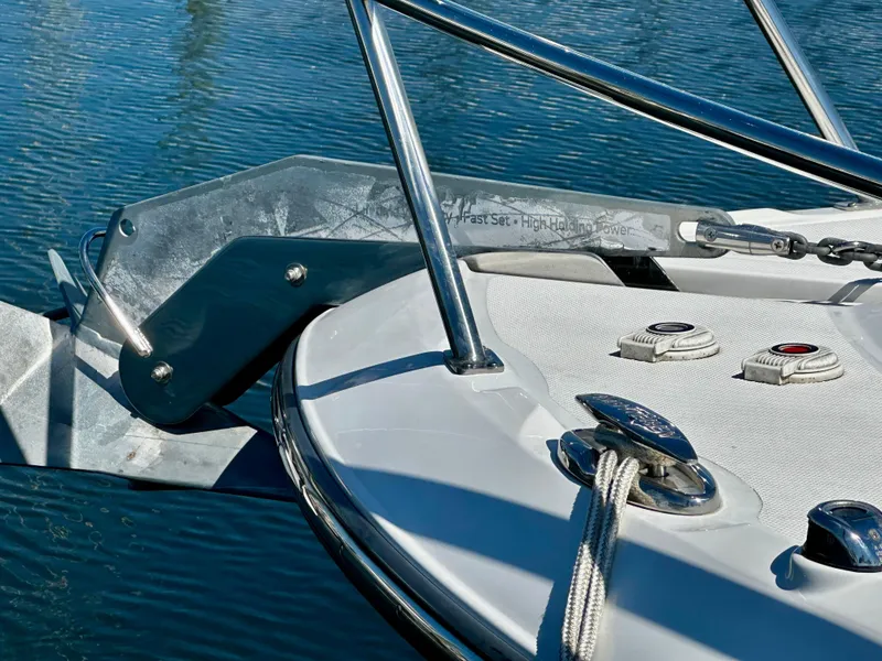Slide: The Image of Bow of 2021 Monterey 335 Sport Yacht with anchor and ropes on calm water. - 9