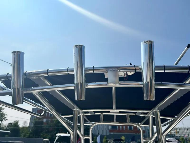 Slide: The Image of 2025 Key West 189 FS boat with stainless steel rod holders and T-top. - 13