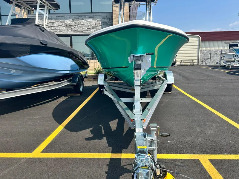 Slide: The Image of 2025 Key West 189 FS boat on trailer in parking lot. - 2