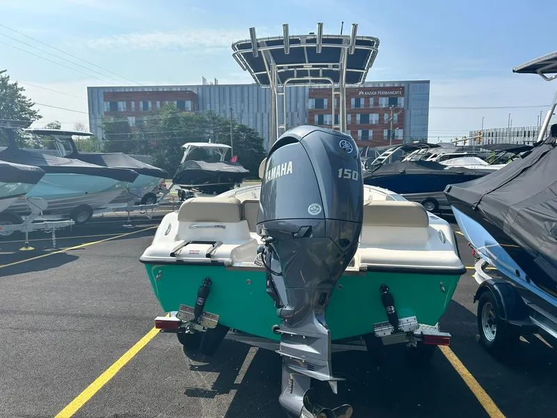 Slide: The Image of 2025 Key West 189 FS boat with Yamaha 150 engine in a marina. - 3