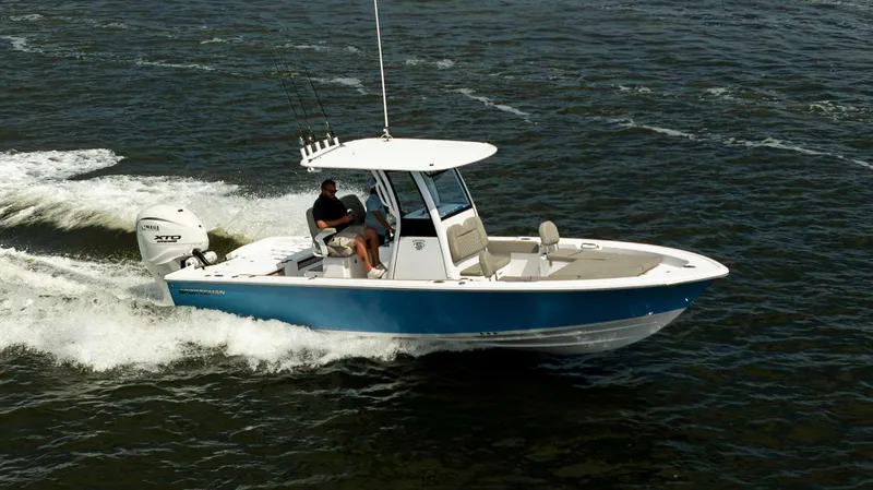 Slide: The Image of 2025 Sportsman 267 Masters boat cruising on open water, featuring sleek design and powerful engine. - 1