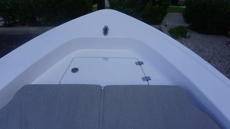 Slide: The Image of Bow of 2025 Sportsman 267 Masters boat with wet deck and storage hatch. - 13