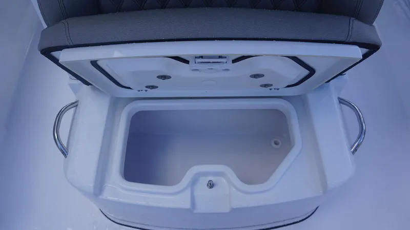 Slide: The Image of Open storage compartment on 2025 Sportsman 267 Masters boat, featuring cushioned seating. - 15