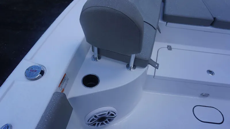 Slide: The Image of 2025 Sportsman 267 Masters boat interior with seating, cup holder, and speaker. - 18