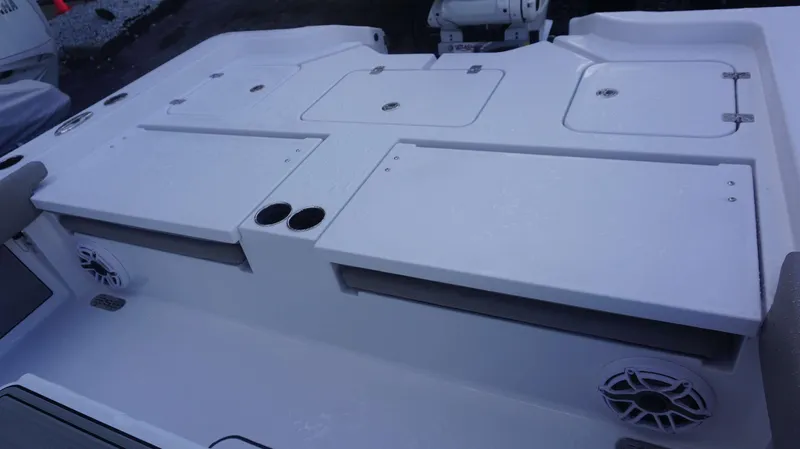 Slide: The Image of 2025 Sportsman 267 Masters boat deck with storage compartments and speakers. - 25