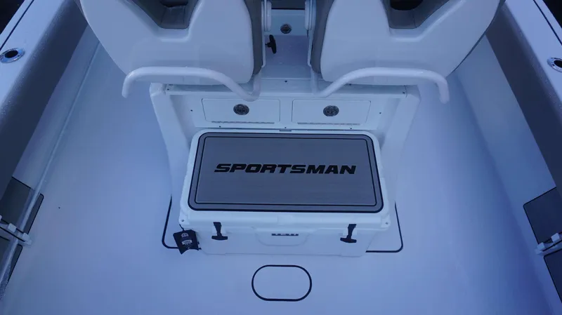 Slide: The Image of 2025 Sportsman 267 Masters boat interior with seating and storage compartments. - 27