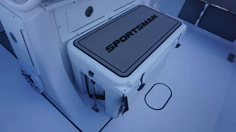 Slide: The Image of 2025 Sportsman 267 Masters boat deck with branded cooler. - 28