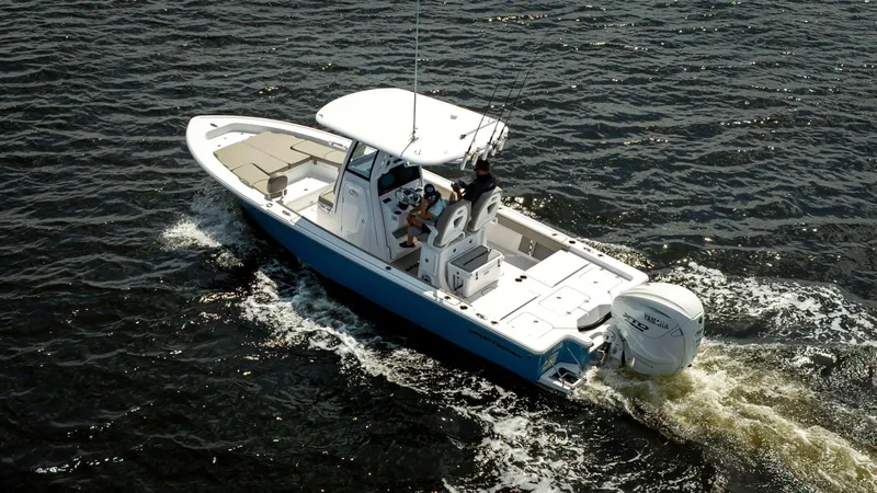 Slide: The Image of 2025 Sportsman 267 Masters boat cruising on open water, aerial view. - 3