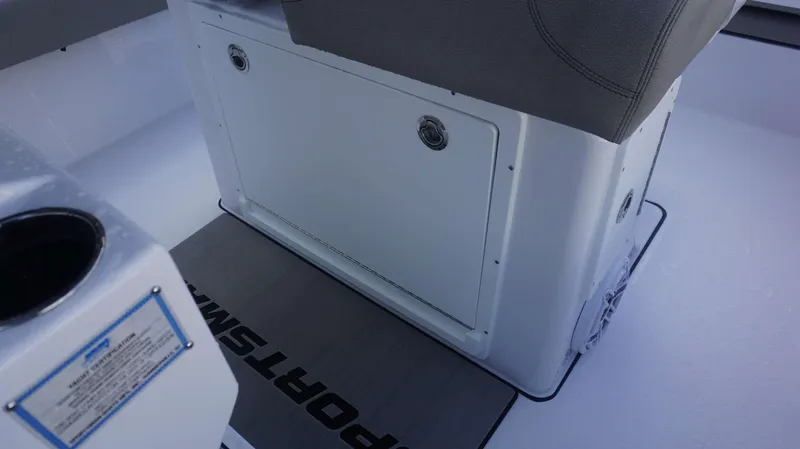 Slide: The Image of 2025 Sportsman 267 Masters boat interior, featuring storage compartment and seating area. - 31