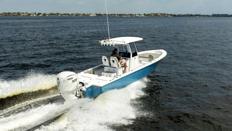 Slide: The Image of 2025 Sportsman 267 Masters boat cruising on open water, featuring Yamaha engine. - 5