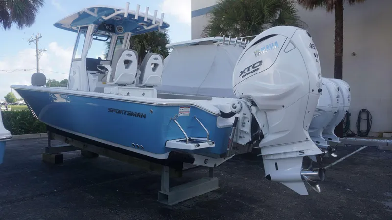 Slide: The Image of 2025 Sportsman 267 Masters boat with Yamaha XTO outboard engines, displayed outdoors. - 8