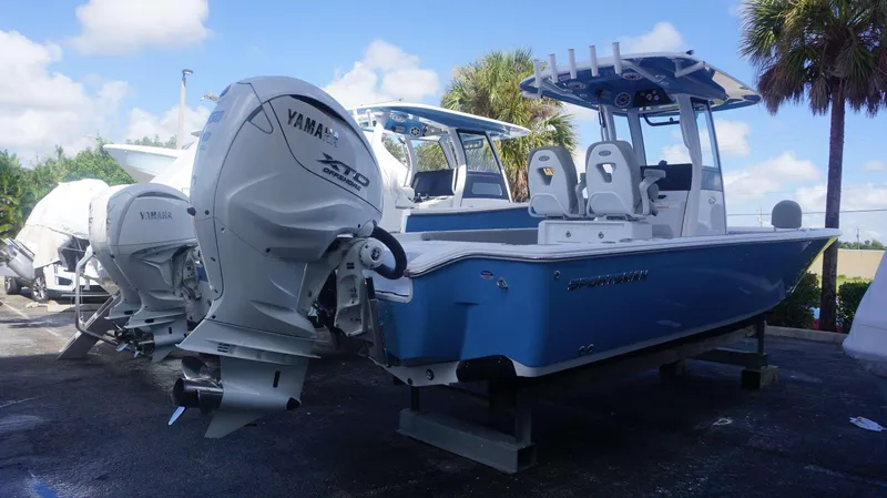 Slide: The Image of 2025 Sportsman 267 Masters boat with Yamaha engines, displayed outdoors under a clear sky. - 9