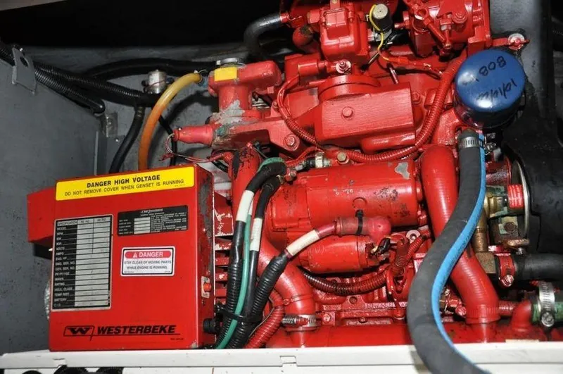Slide: The Image of Engine compartment of a 1998 Sea Ray 370 Sundancer with Westerbeke generator. - 12