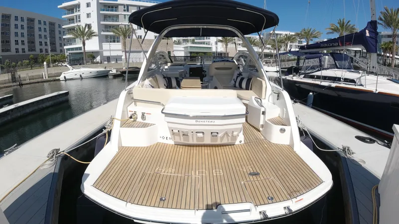 Slide: The Image of 2016 Beneteau GT35 yacht docked at a marina, showcasing its spacious deck and luxurious seating. - 42