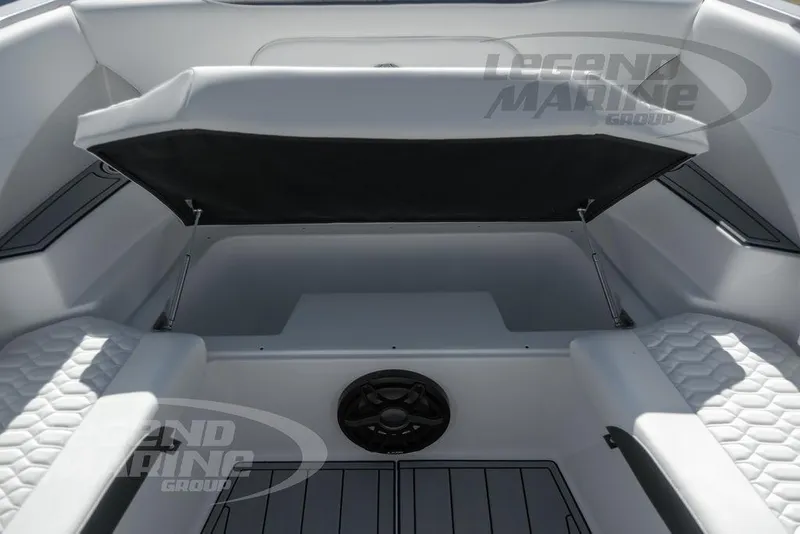 Slide: The Image of 2024 Nor-Tech 340 Sport boat interior with cushioned seating and storage compartment. - 39